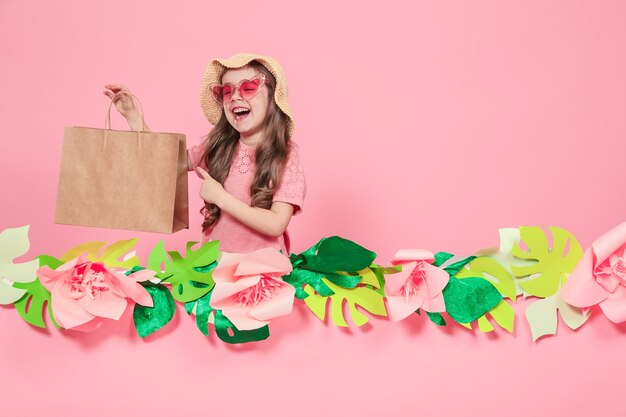 Portrait of cute little girl with shopping bag