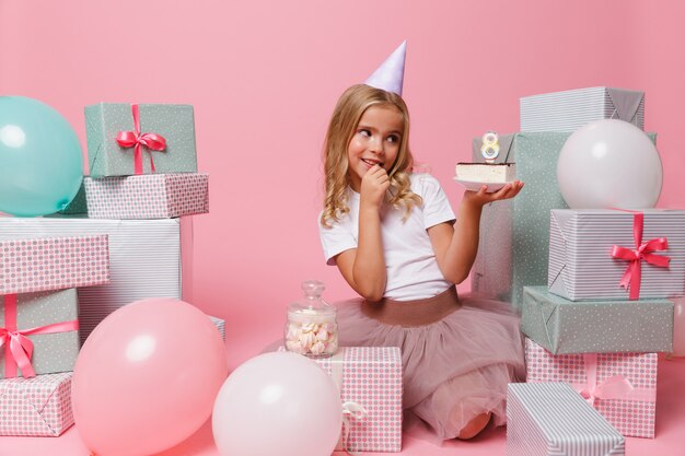 Portrait of a cute pretty little girl in a birthday hat