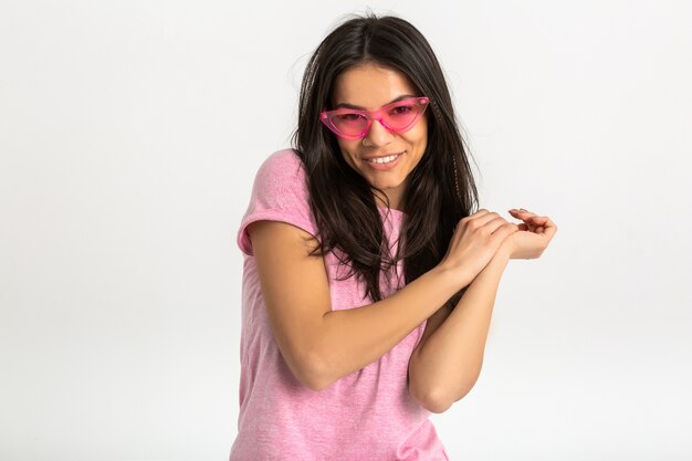 Portrait of cute pretty smiling emotional woman in pink shirt and stylish sunglasses, positive posing isolated