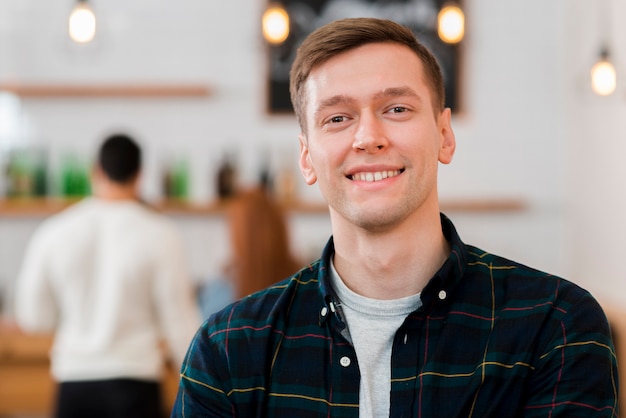 Portrait of cute smiling boy in cafe