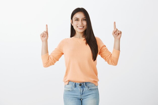 Portrait of cute tanned brunette in casual clothes