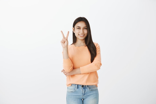 Portrait of cute tanned brunette in casual clothes