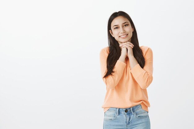 Portrait of cute tanned brunette in casual clothes