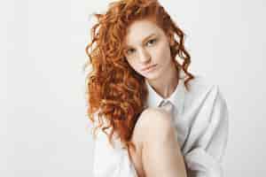 Free photo portrait of cute tender ginger woman with curly hair.