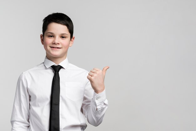 Portrait of cute young boy with copy space