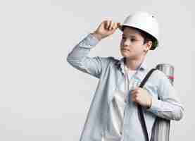 Free photo portrait of cute young engineer looking away