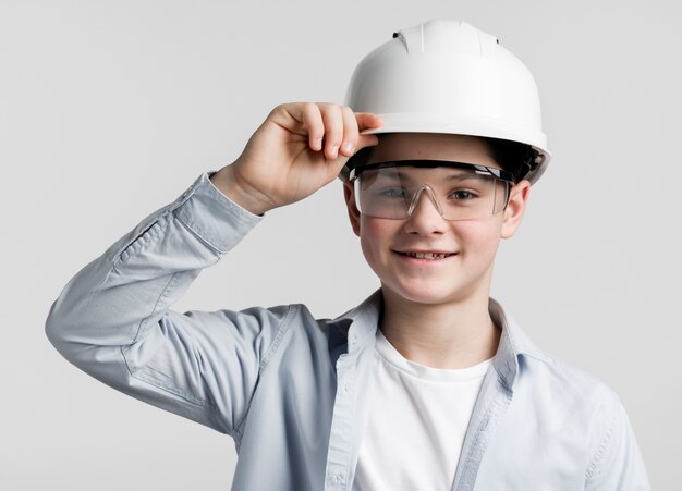 Portrait of cute young engineer posing