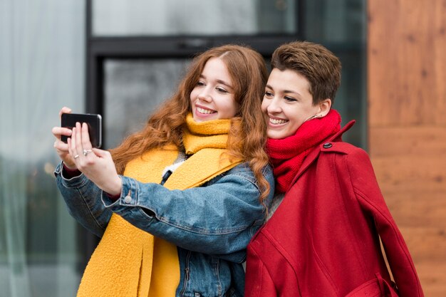 Portrait of cute young girl taking a picture together