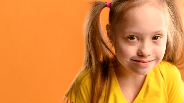 Portrait of cute young girl with copy space