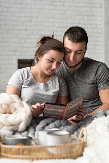 Portrait of cute young man and woman indoors