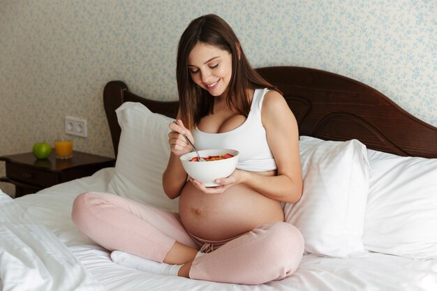 Portrait of a cute young pregnant woman