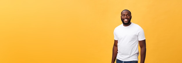 Portrait of delighted african american male with positive smile white perfect teeth looks happily at