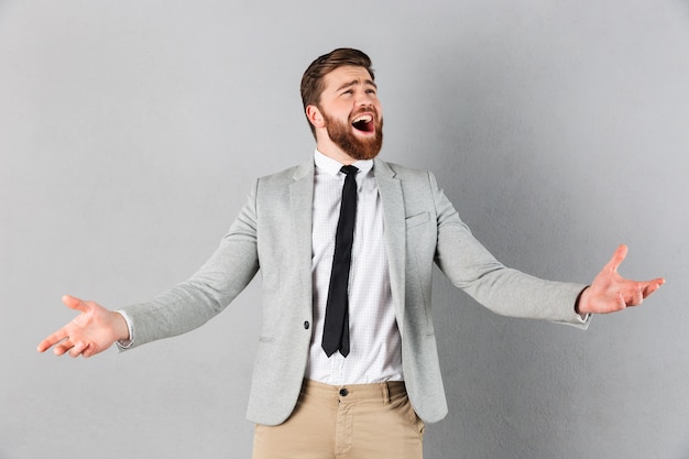 Portrait of a delighted businessman dressed in suit