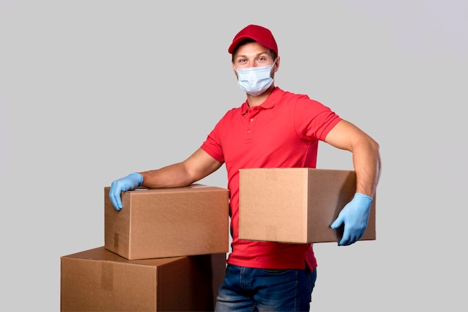 Portrait delivery man carrying packages