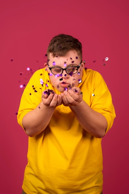 Portrait of disabled man with confetti