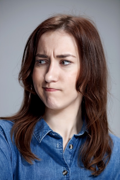 Free photo portrait of disgusted woman