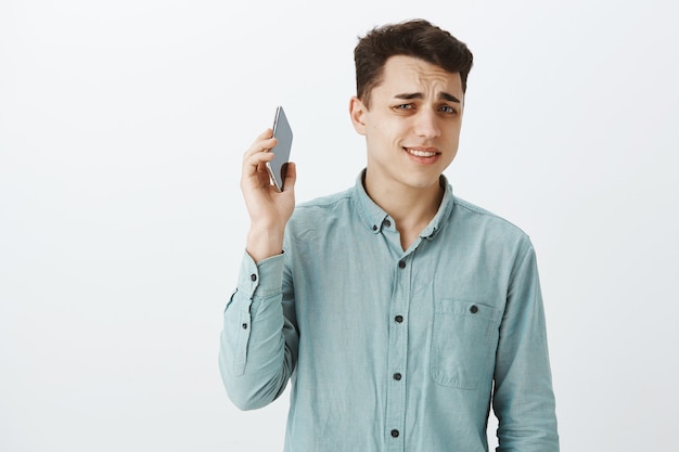 Portrait of displeased annoyed good-looking guy in casual outfit