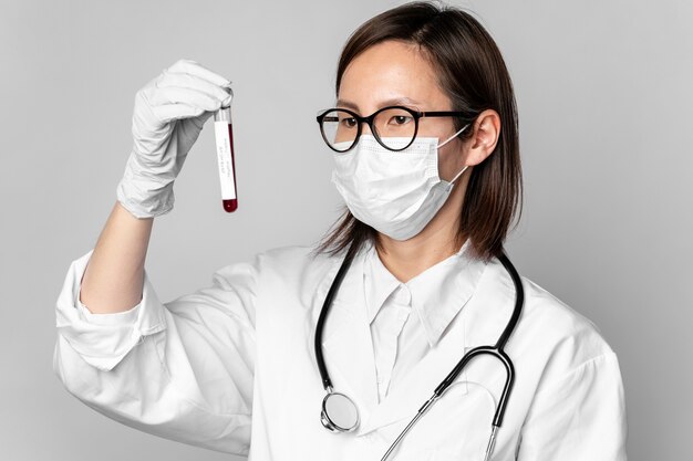 Portrait of doctor checking dangerous medical samples