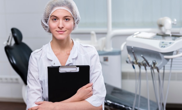 Portrait of doctor holding clipboard