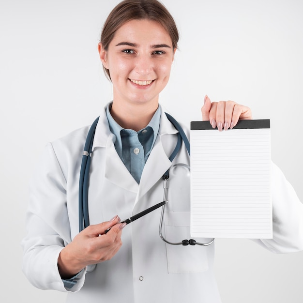 Portrait of doctor holding medical prescription