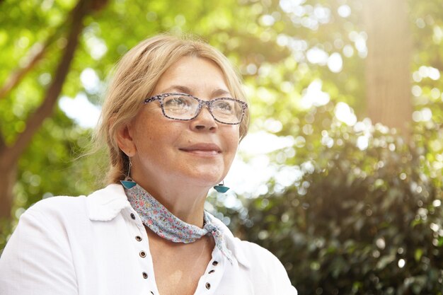 Portrait of elderly woman in park