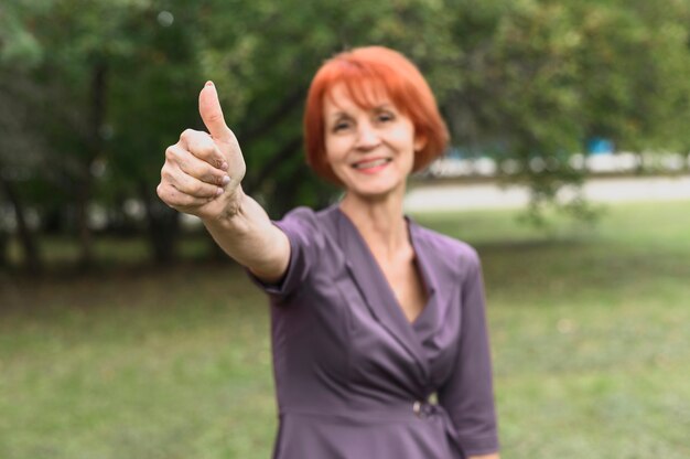 Portrait of elderly woman with red hair