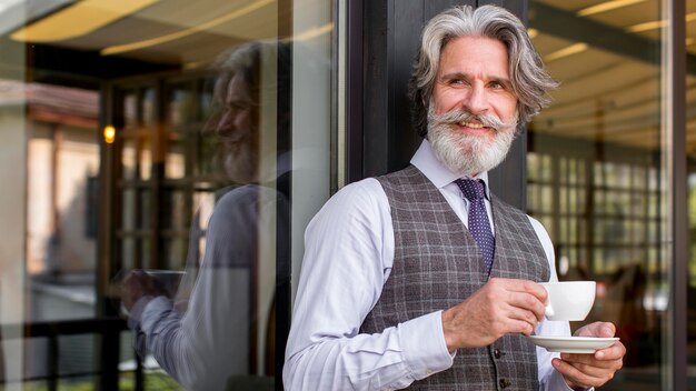 Portrait of elegant mature man looking away