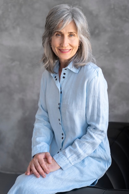 Free photo portrait of elegant older woman posing and being happy