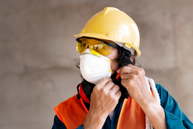 Portrait employee with safety equipment