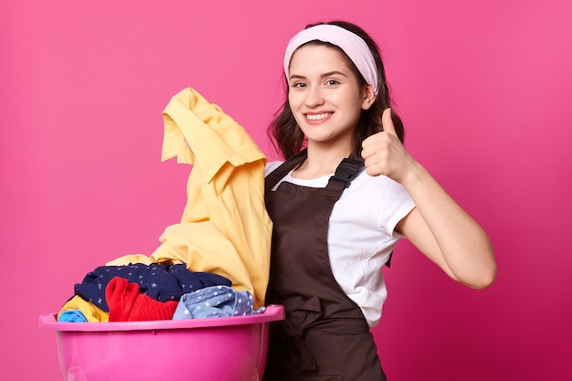 Portrait of energetic positive cute female looking directly at camera with happiness