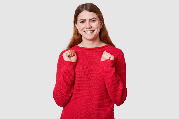 Portrait of energetic woman has brown straight hair