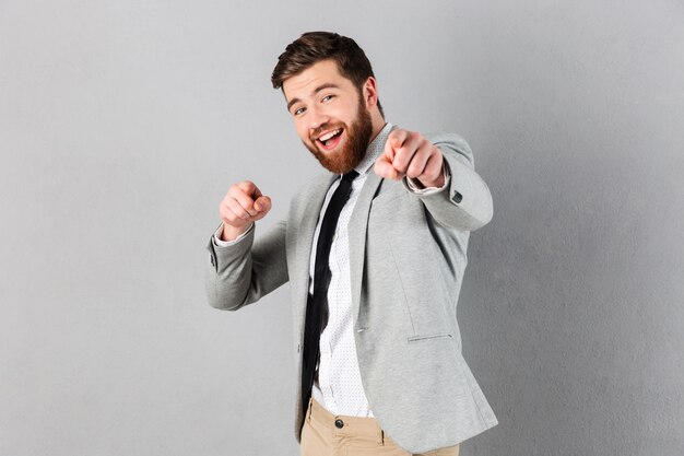 Portrait of an excited businessman dressed in suit