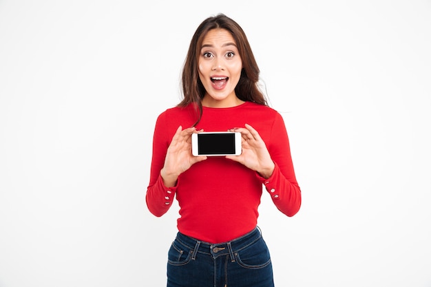 Portrait of an excited cheery asian woman