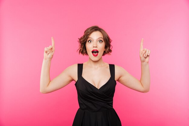 Portrait of an excited girl dressed in black dress