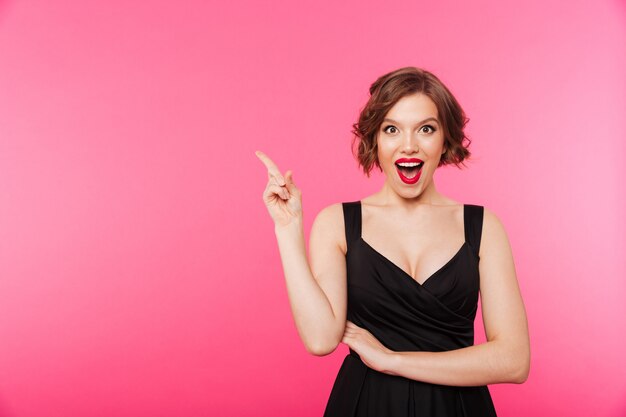 Portrait of an excited girl dressed in black dress