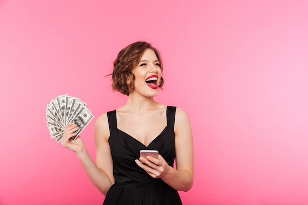 Portrait of an excited girl dressed in black dress