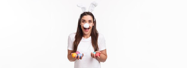 Portrait of excited happy and carefree young woman spending holiday with family wearing funny rabbit