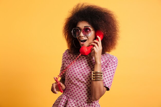 Portrait of an excited pretty afro american woman