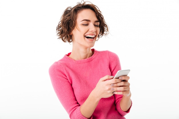 Portrait of an excited pretty girl playing games