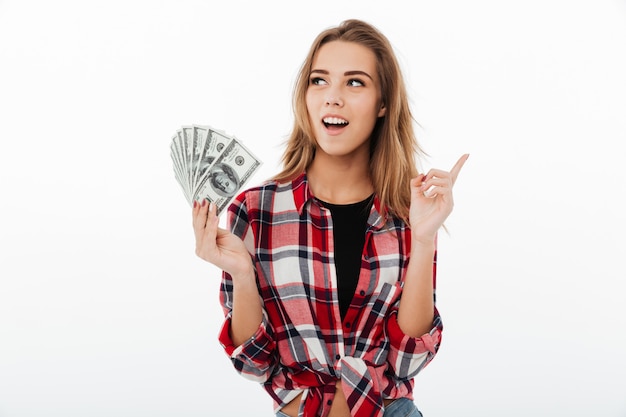 Portrait of an excited smiling girl in plaid shirt