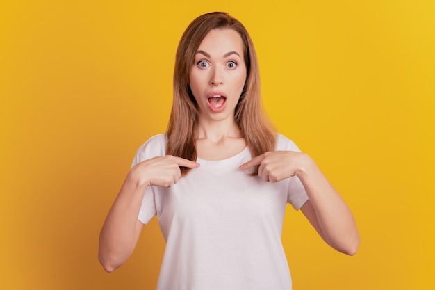 Premium Photo Portrait Of Excited Woman Pointing Fingers Herself Funny Reaction