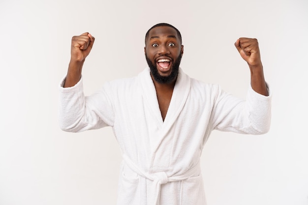 Portrait of excited young African American male screaming in shock and amazement holding hands on head Surprised black man looking impressed