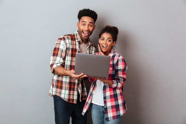 Free photo portrait of an excited young african couple