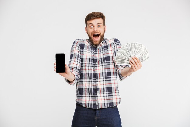 Portrait of an excited young man in plaid shirt