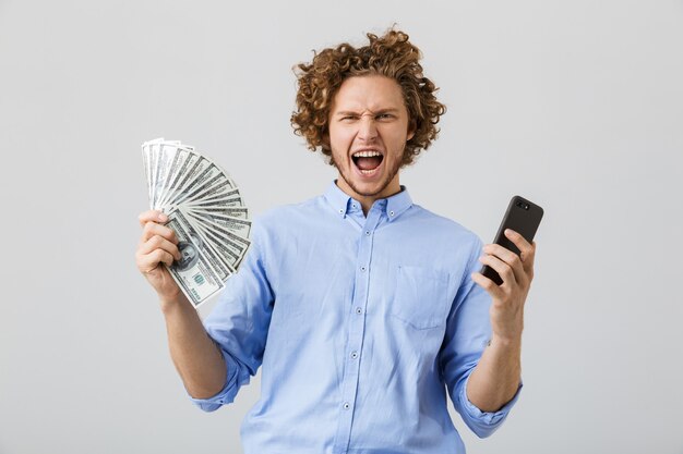 Portrait of an excited young man with curly hair