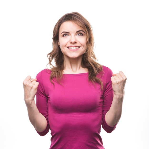 Portrait of an excited young woman on white background