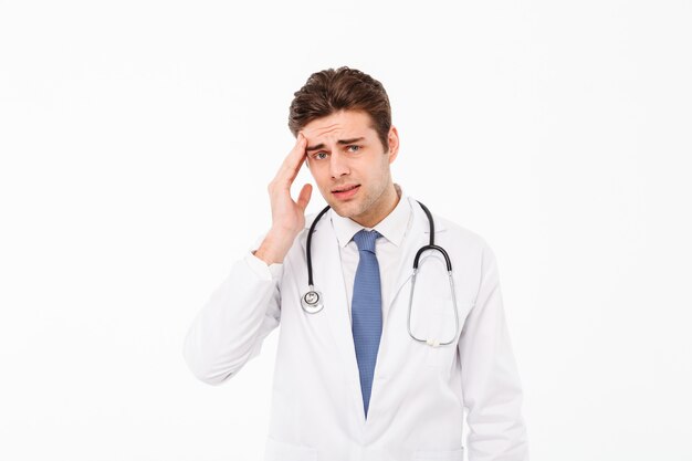 Portrait of a exhausted young male doctor man