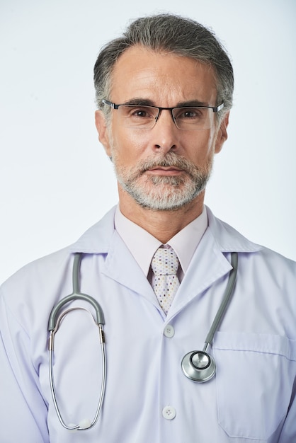 Portrait of experienced professional therapist with stethoscope looking at camera