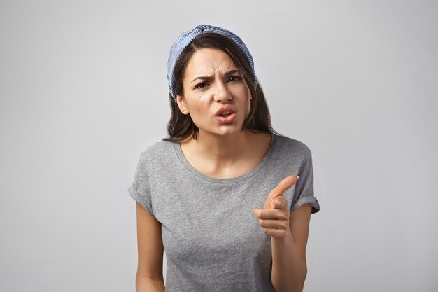 Portrait of an expressive woman posing in the studio