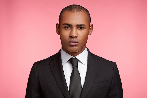 Portrait of expressive young man wearing formal suit